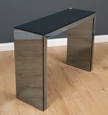 Lot 216 - A modern mirrored side table with bevelled...