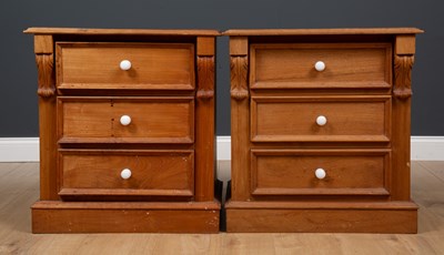 Lot 222 - A pair of teak three drawer bedside cabinets...