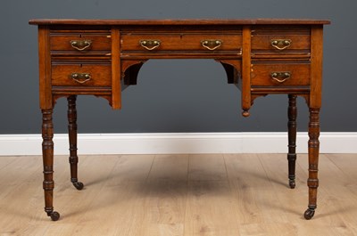 Lot 224 - An Edwardian rosewood five drawer writing...
