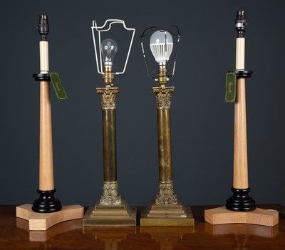 Lot 225 - A pair of brass table lamps of Corinthian...