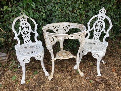 Lot 228 - A white painted cast iron garden table base...