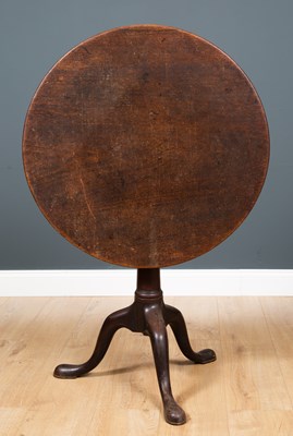 Lot 198 - A George III tilt top tripod table with a bird...