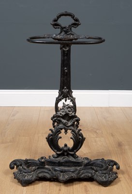 Lot 328 - A painted cast iron stick stand 49cm wide x...