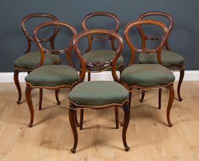 Lot 330 - A set of six Victorian walnut balloon back...
