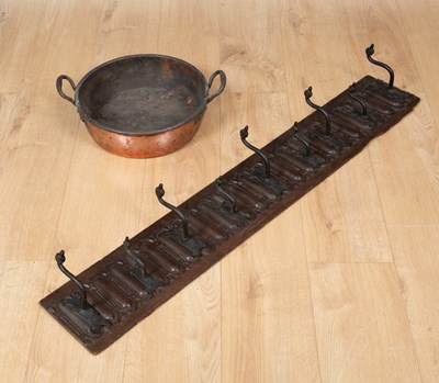 Lot 346 - An antique set of nine coat hooks mounted on...