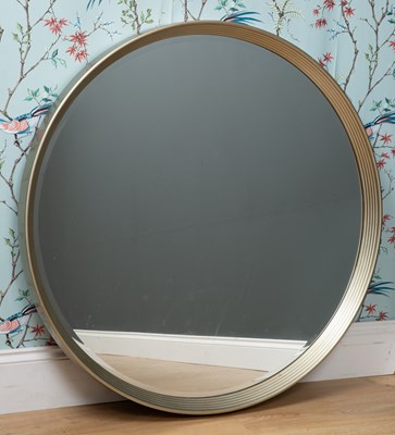 Lot 275 - A modern circular wall mirror with deep...