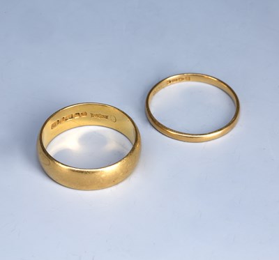 Lot 216 - Two 22ct gold rings or wedding bands, the...