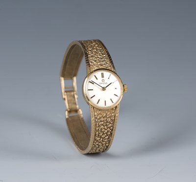 Lot 213 - Lady's bracelet watch by Omega in a 9ct gold...