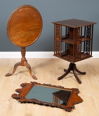 Lot 620 - A tilt-top tripod table with curved carved top...