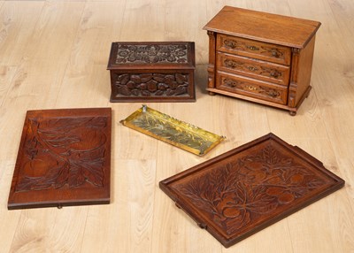 Lot 621 - A miniature French commode with three drawers...
