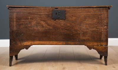 Lot 304 - A 17th century oak coffer on high trestle feet,...