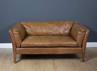 Lot 218 - A contemporary tan leather upholstered two...