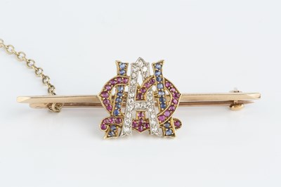 Lot 38 - A ruby, sapphire and diamond set monogram bar...