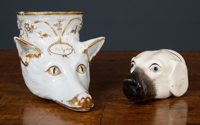 Lot 121 - An early 19th century porcelain stirrup cup in...