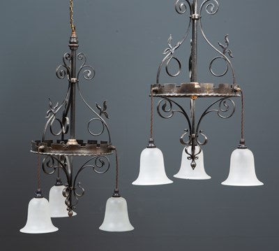 Lot 94 - A pair of wrought steel hanging light fittings...