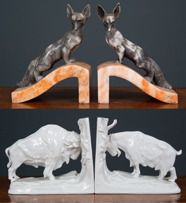 Lot 325 - A pair of marble bookends formed as a black...