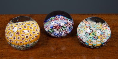 Lot 88 - An old glass paperweight with millefiori cane...