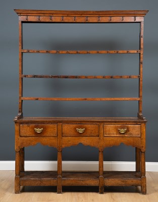 Lot 82 - An 18th century oak dresser with a three tier...